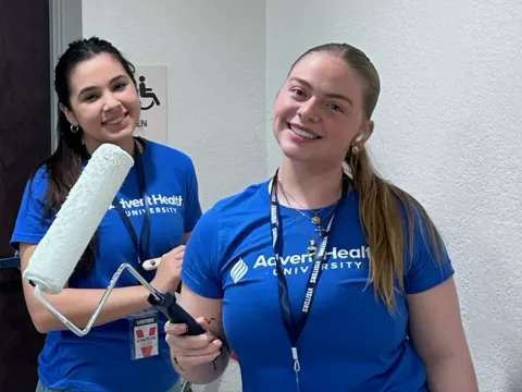 Students painting at Service Day