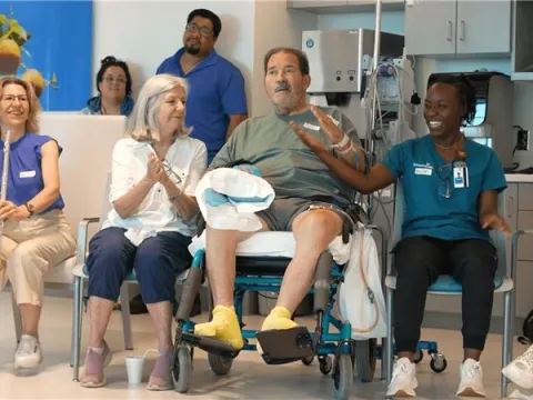 AdventHealth patient and family with staff members