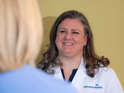 Christina Douglass, MD speaks with a patient