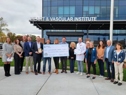 City of Littleton and AdventHealth Littleton representatives pose with award