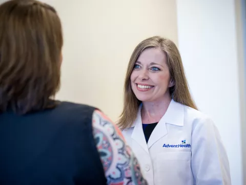 Dana Stewart speaks with patient