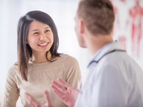 Patient talking with her doctor.