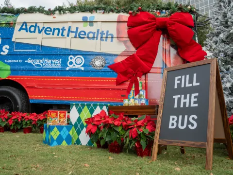 The AdventHealth "Drive Out Hunger" Holiday Bus.