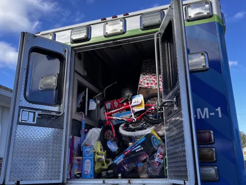 an ambulance is packed with toys ready for children.
