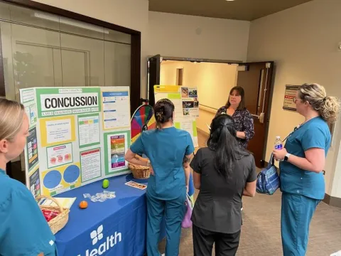 Team member educates others on concussion awareness