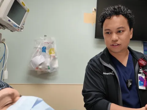 Josh Ramos assisting a patient at the ER in Altamonte Springs. 