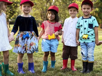 kids standing in a circle and holding hands