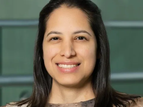 Woman wearing brown blouse