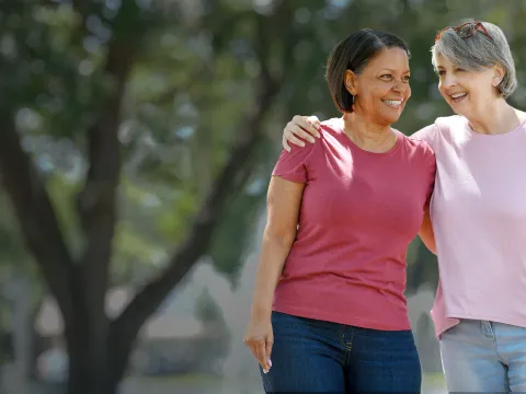 two women talking in park