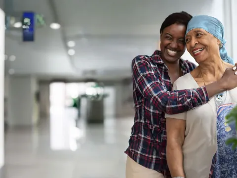 Cancer mom and daughter hugging