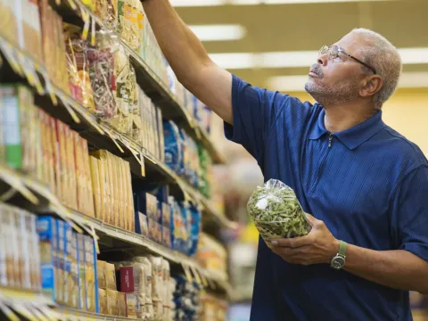 Man at the supermarket shopping for food