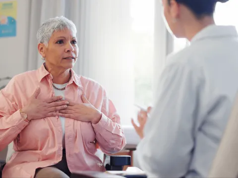 mammograms-woman-with-doctor-hero-2000x1333