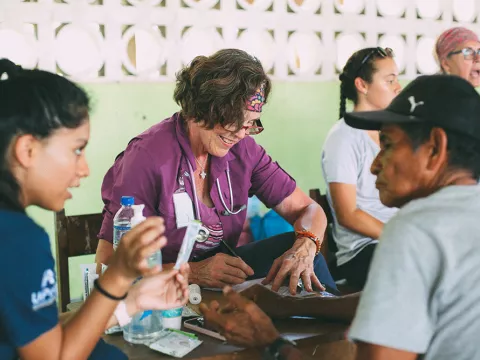 Provider helping patient