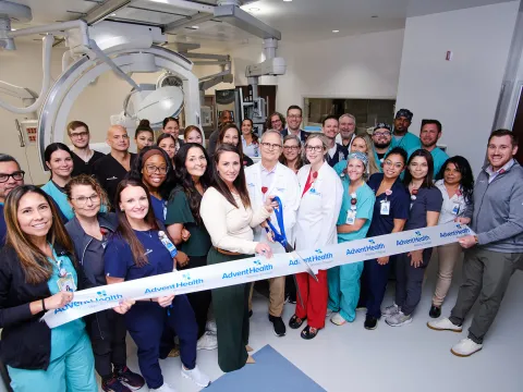 Group of people at the ribbon cutting of Wesley Chapel.