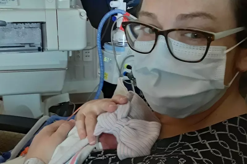 Family relied on video and photo updates from NICU nurses due to COVID-19 restrictions.