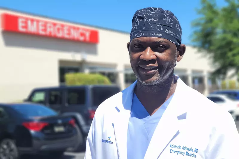 Ademola Adewale, MD in front of Emergency Department at East Orlando