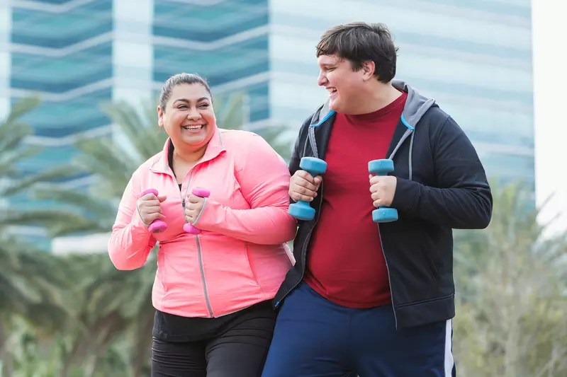 A Man and a Woman Go For a Run Outdoors