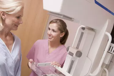 Mammogram technician with patient.