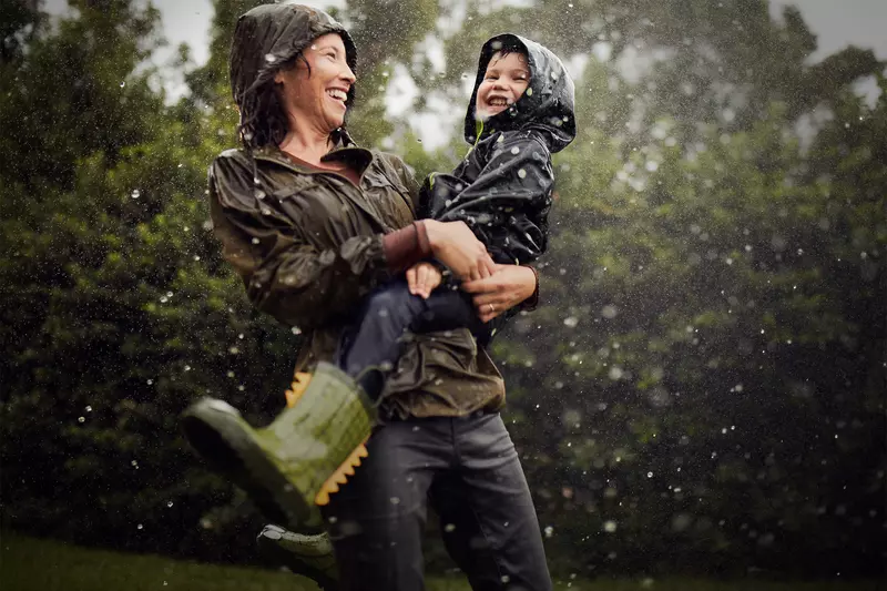 Mom and Child Under a Sprinkler 