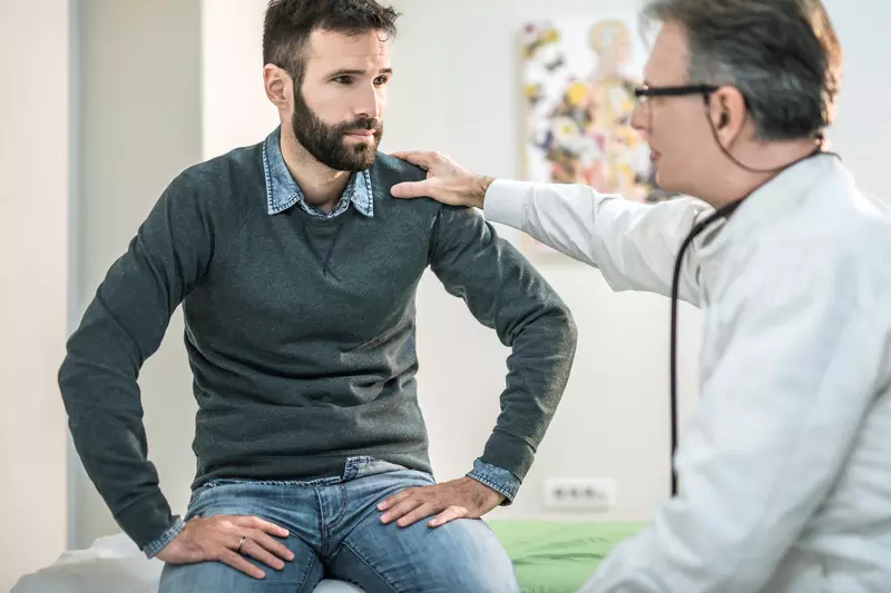 Man at doctor's office for pelvic floor issues
