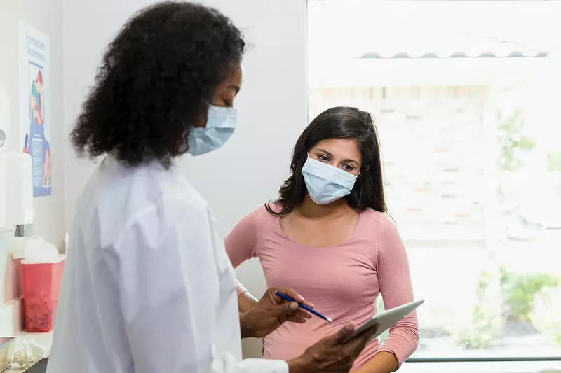 Doctor Talking to a patient about mammogram results.
