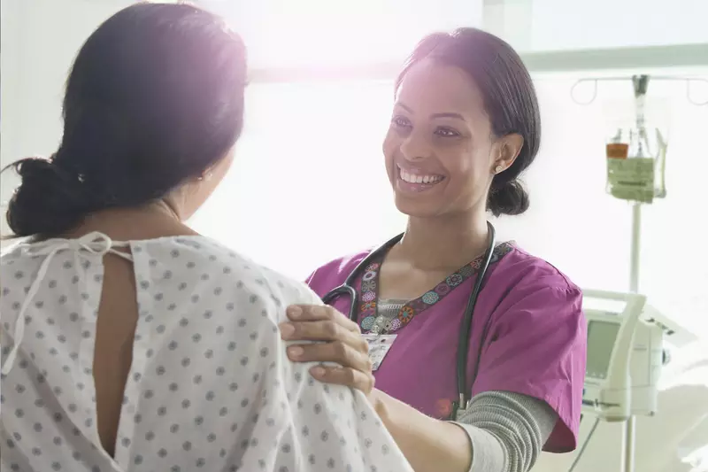 A Nurse Speaks to a Patient with Happy News