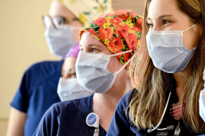 A group of nurses wearing face masks.