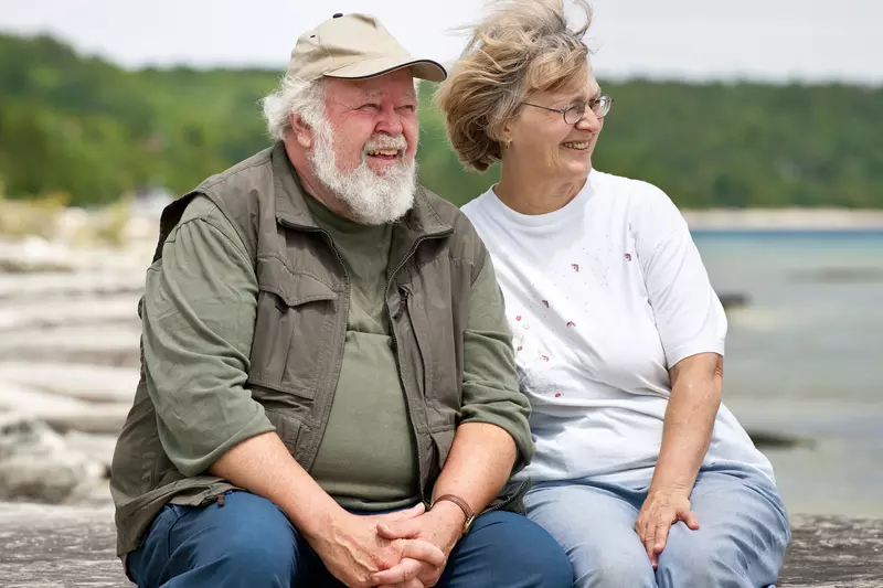 A couple enjoys a day together at a lake.