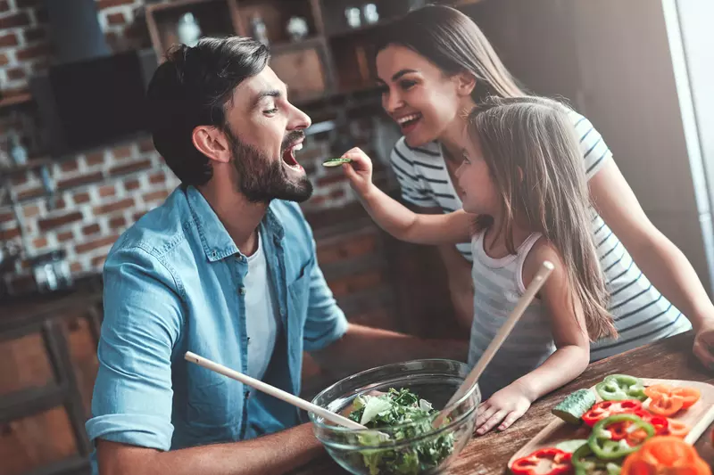 A family enjoying their cooking moment together
