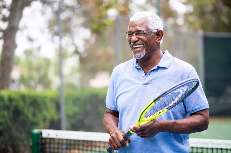 An older gentleman on the tennis court