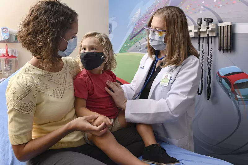 A family in a pediatric emergency room at AdventHealth.