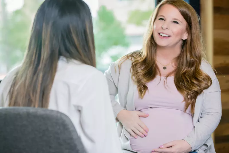 A mom-to-be meets with her doctor.