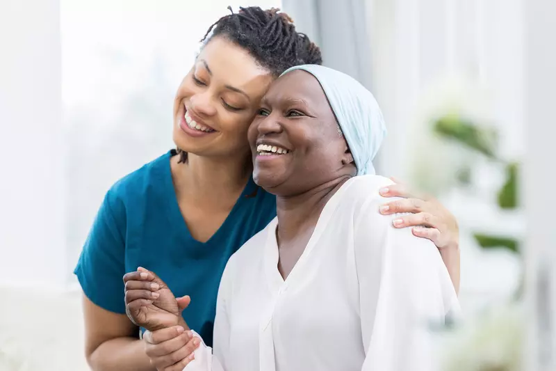 Smiling female patient with nurse
