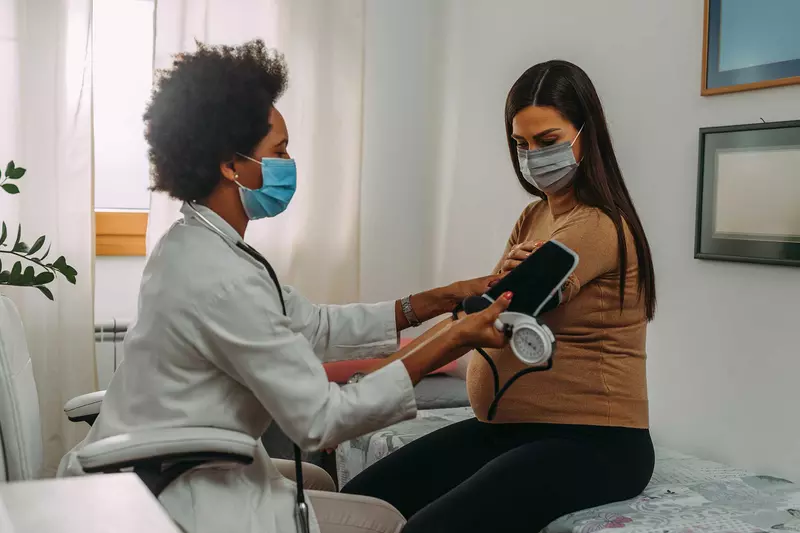 A woman getting a test done by her doctor