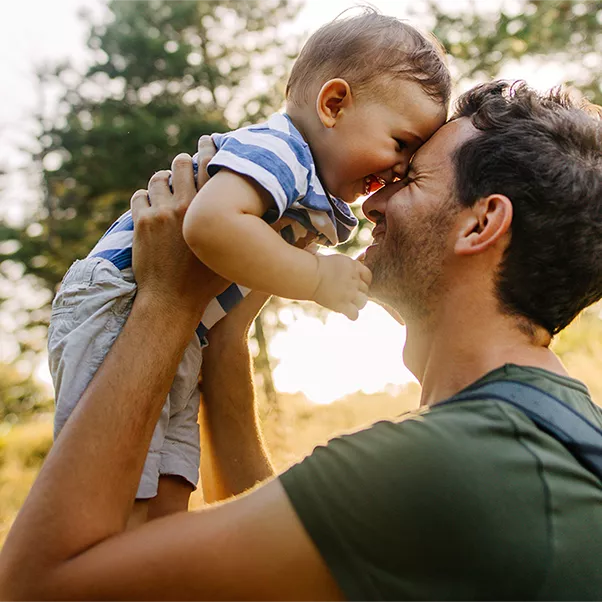 Father holding son