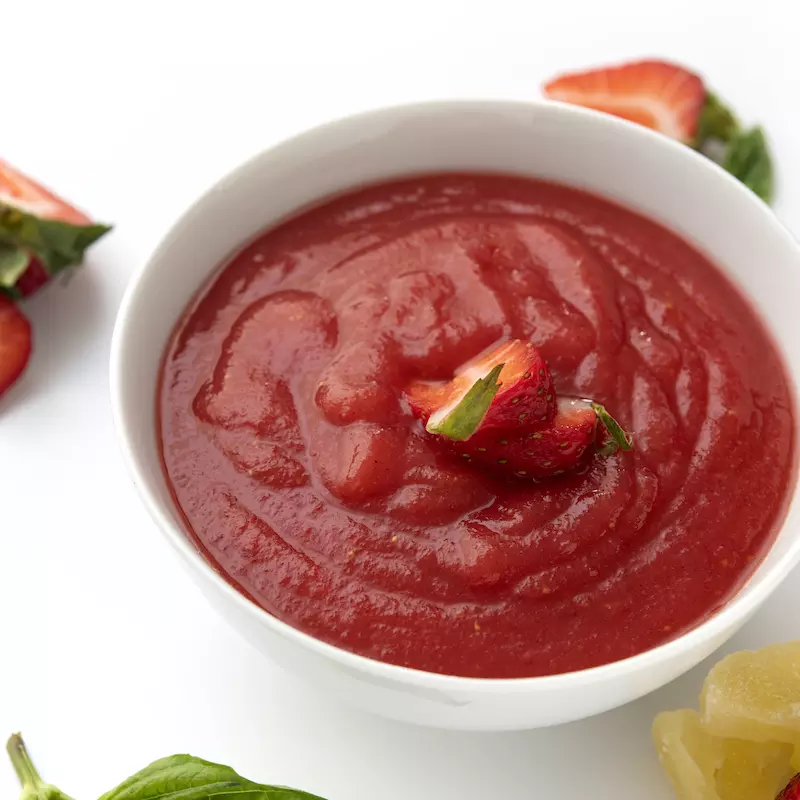 Bowl of strawberry sauce topping