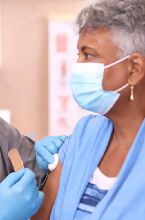 Older woman getting vaccinated