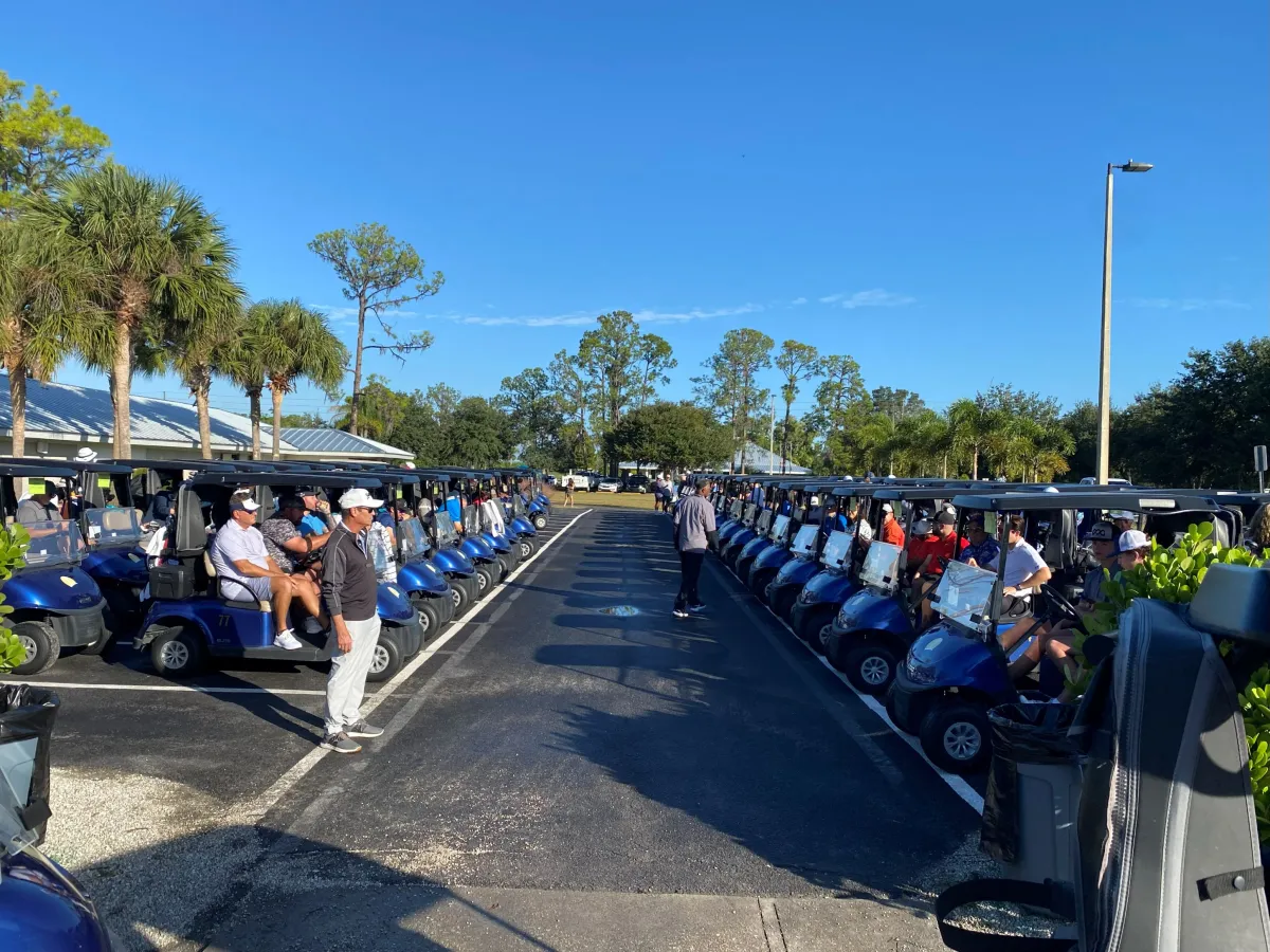 Event participants sitting in their golf carts, waiting for the event to start