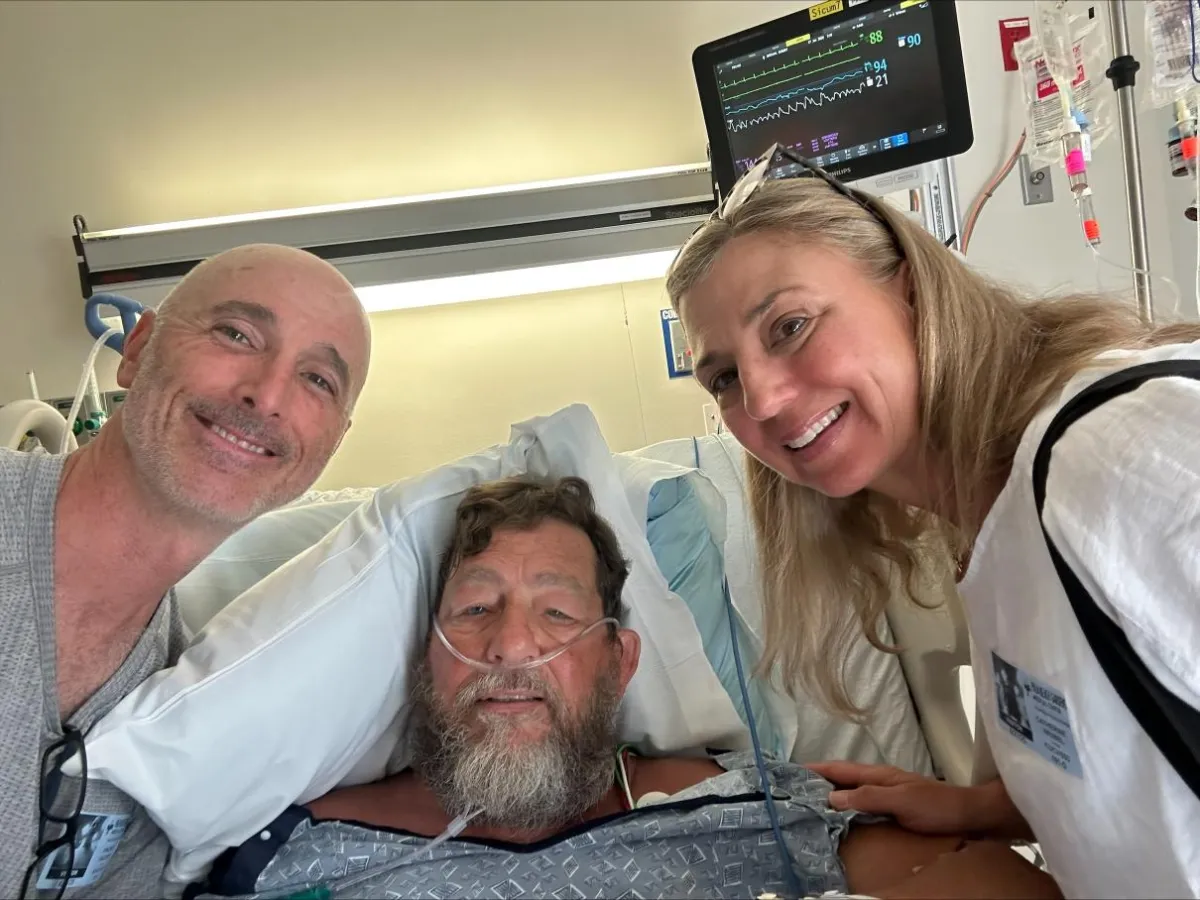 Bruce Brown and Dr. Valente reuniting in the hospital.