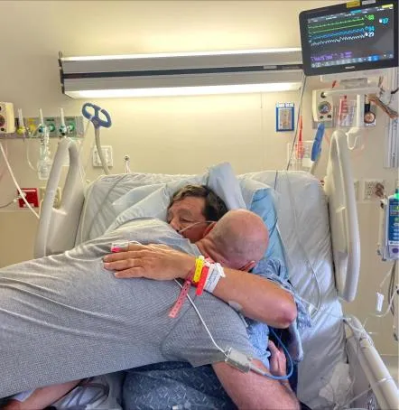 Dr. Valente and Bruce Brown reuniting at the hospital.