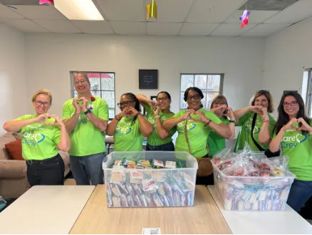 AdventHealth care crew members in green shirts