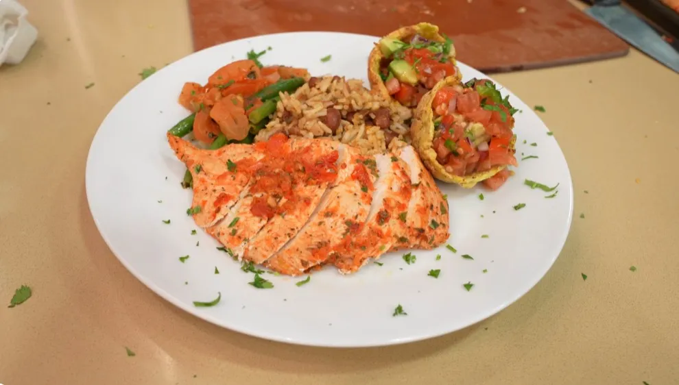 A vibrant Latin feast — spring chicken, mamposteao rice, mofongo cups, and Spanish green beans, all bursting with flavor and heritage.