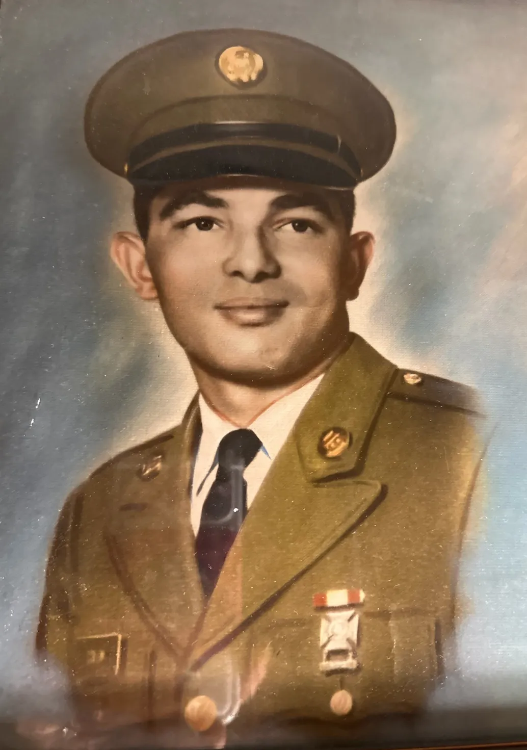 A portrait of Anna Colon-Negron's father in his military uniform