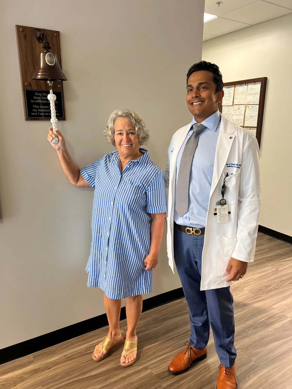  72-year-old cancer survivor, Corrine Graczewski rings the bell signaling the completion of her latest round of cancer treatment. Radiation Oncologist, Dr. Shiv Desai, led her treatment with the new Ethos Technology. 