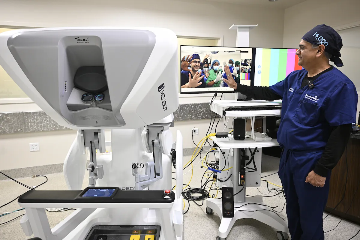 Dr. Vip Patel high fiving team in Angola