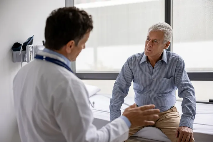 Doctor talking to a patient in a consultation at the office