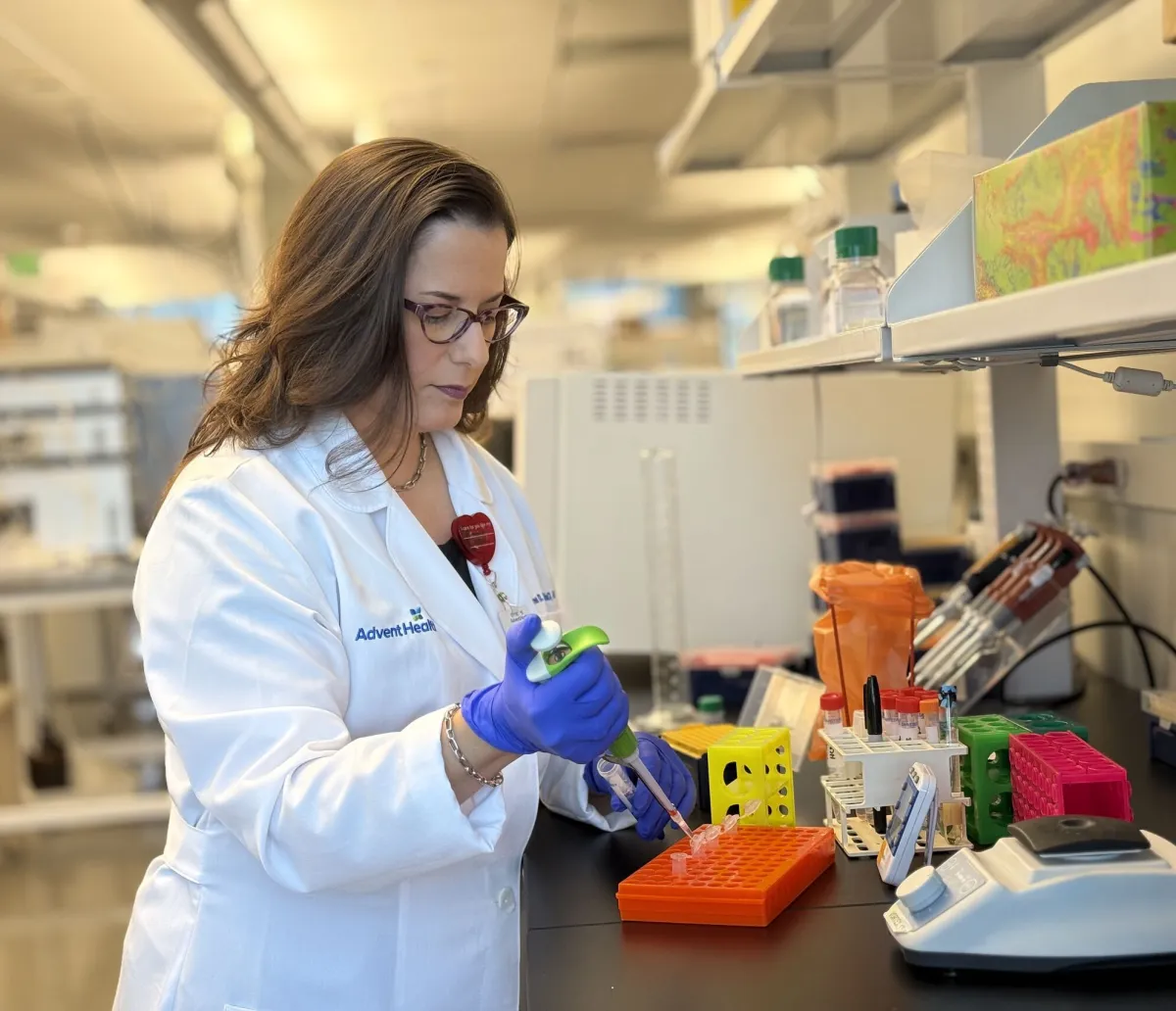 Karen Corbin, Ph.D., a nutrition scientist, works in a lab at the AdventHealth Translational Research Institute.