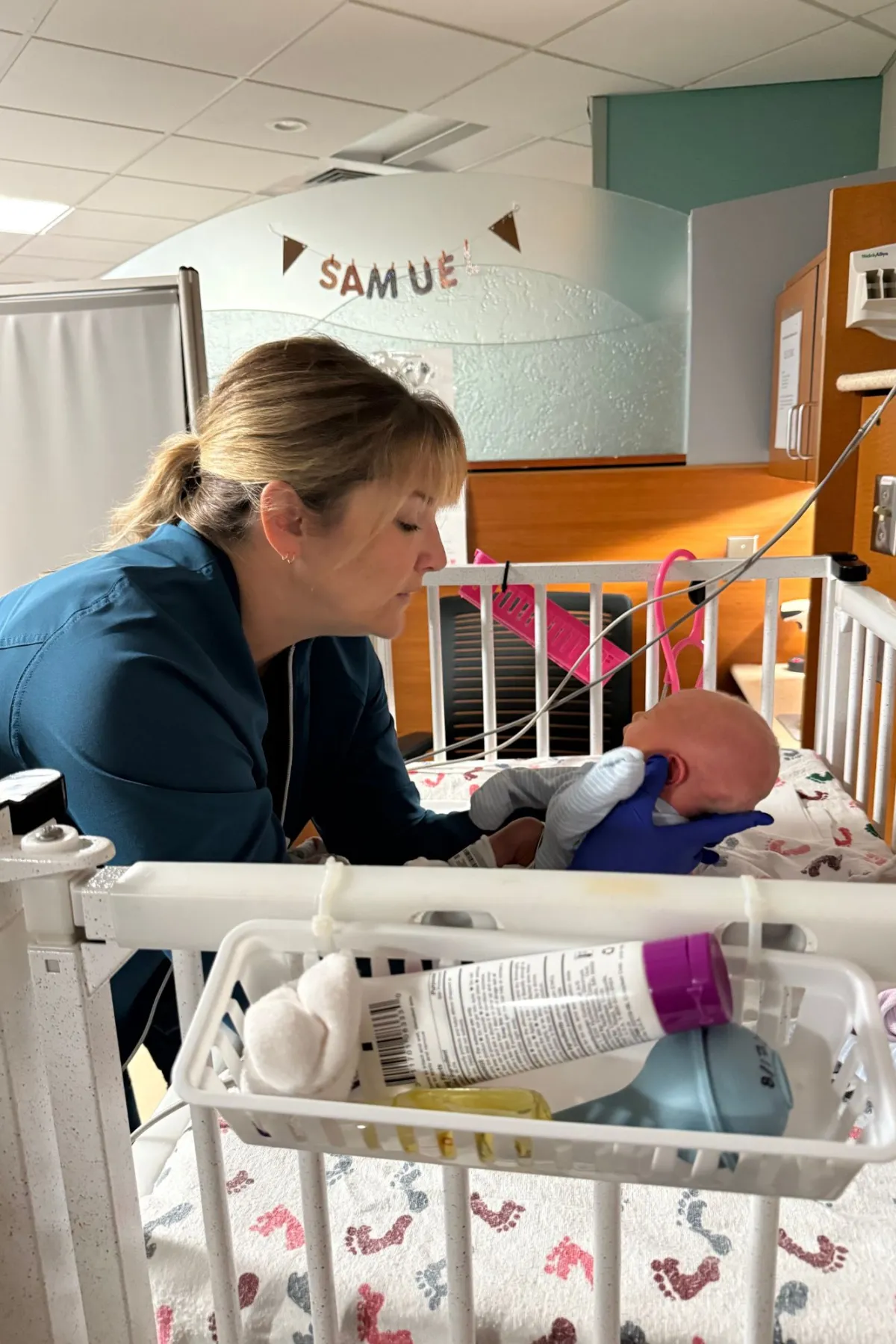 Maggie holds baby Samuel in the NICU