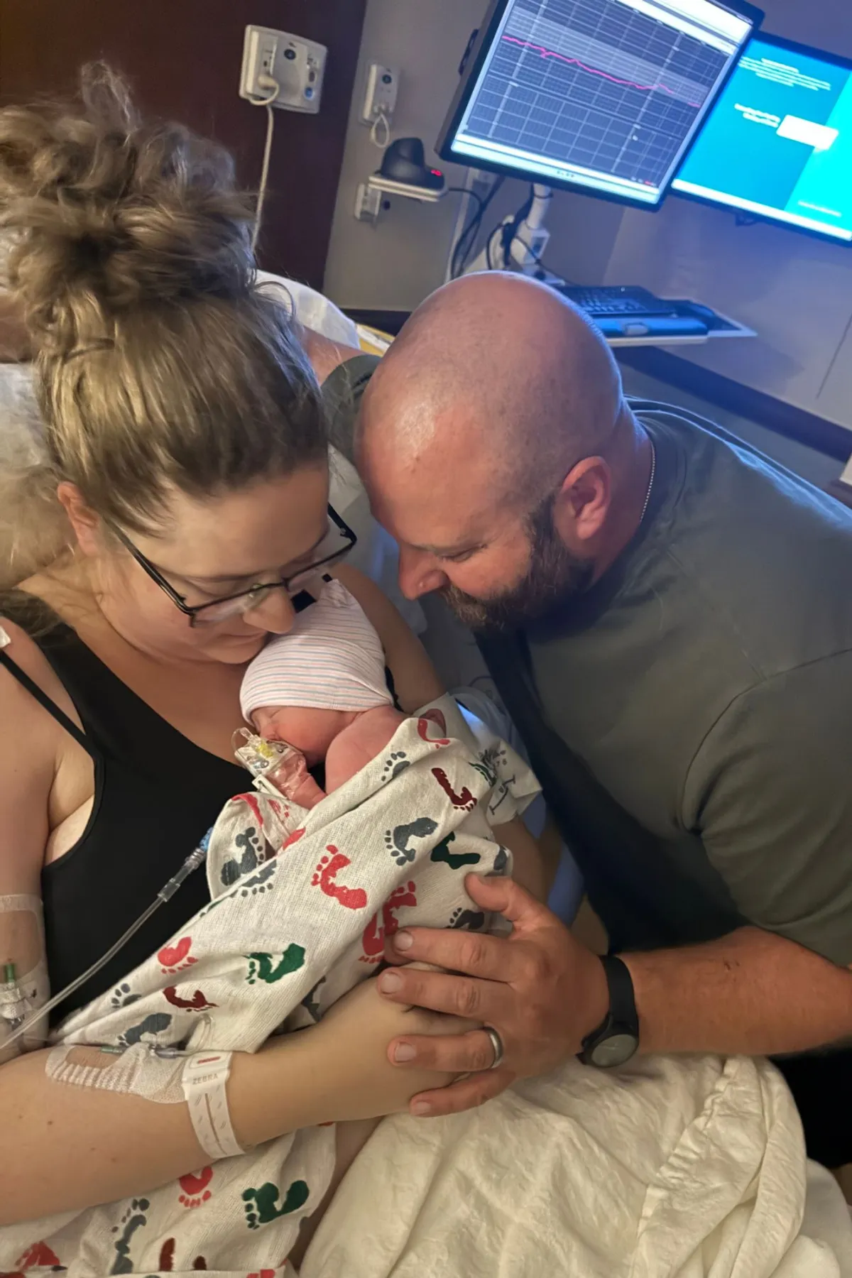 The Clarkson family snuggles their new baby