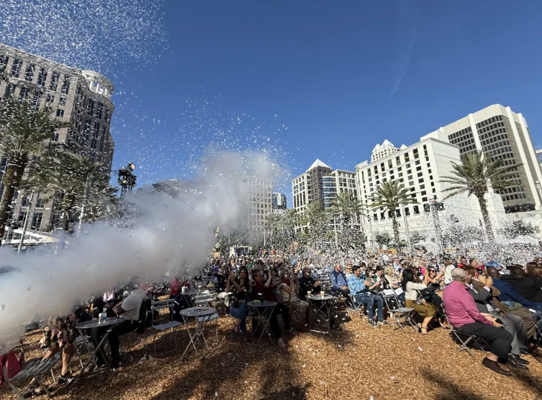 Moments after the ribbon-cutting ceremony, attendees were surprised by a burst of confetti snowflakes and falling snow, adding a magical start to the Frontyard Holiday Festival.